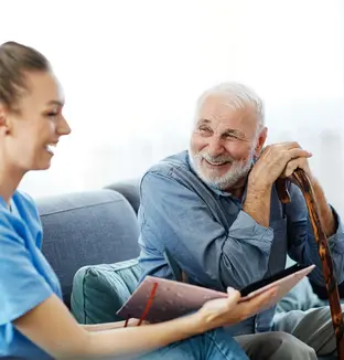 senior man talking to young woman
